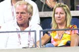 Golfer Greg Norman of Australia sits with his wife and former tennis player Chris Evert during Day 11 of the 2008 U.S. Open at the USTA Billie Jean King National Tennis Centre