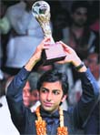 Pankaj Advani poses with the winner's trophy after the final of the International Billiards and Snooker Fedaration (IBSF) World Championship in Bangalore