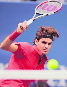 Roger Federer of Switzerland watches a return to Novak Djokovic of Serbia during the men�s semis at the US Open on Saturday in New York.