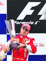 Ferrari Formula One driver Felipe Massa of Brazil holds his trophy on the podium of the Belgian F1 Grand Prix at the Spa-Francorchamps race track on Sunday