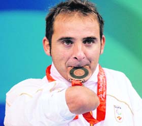 Swimmer Daniel Vidal of Spain holds his bronze medal after the men�s 4x50m medley 20 PTS final during the 2008 Beijing Paralympic Games