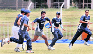 Players of the Rest of India team warm up with a frisbee during net practice at the Reliance Stadium on Tuesday as they prepare to take on Delhi in the Irani Cup match from Wednesday. 