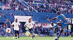 Portsmouth�s Jermain Defoe (R) scores his penalty against Tottenham during the game at Fratton Park in Portsmouth
