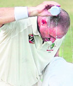 Mathew Hayden pours water over his head on the final day of their four-day practice match against Board President's XI in Hyderabad on Sunday. The Australian team start their four-match Border-Gavaskar Test series against India with their first Test starting in Bangalore on October 9.
