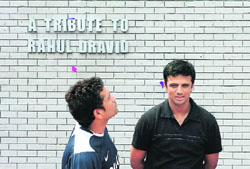 Sachin Tendulkar (L) and Rahul Dravid look on during a function at the Chinnaswamy Stadium in Bangalore on Monday. A private real estate company organised the function to unveil a wall constructed to honour Rahul Dravid for his achievement of scoring more than 10,000 runs, scored in both Test cricket and one day internationals. 