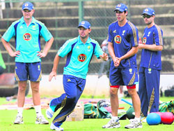 Australia's captain Ricky Ponting (2nd L) runs to catch the ball as his teammates Doug Bollinger (L), Mitchell Johnson (2nd R) and Simon Katich watch during a practice session in Bangalore on Tuesday. 