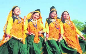 Village belles don traditional attire at a wedding ceremony.