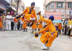 Nihangs perform martial arts during a procession organised on the occasion of Shiromani Bhagat Baba Namdev birth anniversary in Bathinda