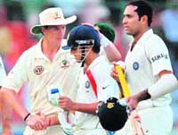 Australia�s Brett Lee greets Gautam Gambhir after end of first day�s play at the Ferozeshah Kotla stadium in New Delhi 