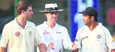 Umpire Billy Bowden separates warring players Gautam Gambhir (right) and Australia�s Simon Katich during the first day of the third Test at Ferozeshah Kotla stadium in New Delhi 