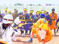 Gatka players in action at Hazur Sahib on Saturday. 