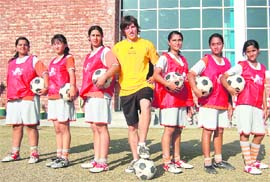 Sean Clancy, coach, Liverpool FC Academy, along with trainees at Unison World school in Dehradun. 