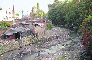Encroachments alongside the Rispana river in Dehradun.
