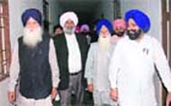 Former education minister Tota Singh (seond from right) waits for his son Barjinder Singh, an accused in the Moga sex scam, outside a special CBI court in Patiala