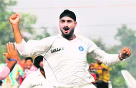 Harbhajan Singh celebrates the dismissal of Australian batsman Shane Watson