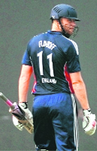 Andrew Flintoff walks back after his dismissal. 