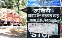 A kiosk with windows covered with copies of newspapers at the commercial tax checkpost at Assa Rori, Dehradun.