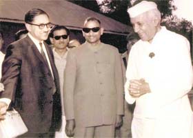 Pandit Nehru in a jovial mood on one of his frequent visits to Dehradun, talks to commissioner Meerut BD Sanwal and district magistrate AP Dikshit (centre) at the helipad