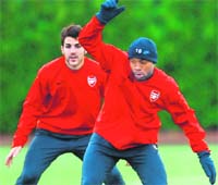 Arsenal�s William Gallas (R) and Cesc Fabregas in training at the London Colney ground 