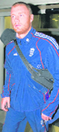 England captain Kevin Pietersen (L) and all rounder Andrew Flintoff arrive at Heathrow airport from India on Saturday.