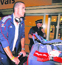 England captain Kevin Pietersen (L) and all rounder Andrew Flintoff arrive at Heathrow airport from India on Saturday.
