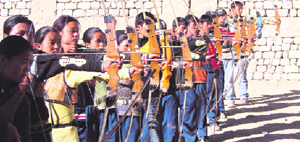 Young girls practise archery in Leh.