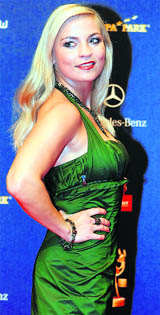 German boxer Regina Halmich arrives on the red carpet for the 60th Bambi media awards ceremony in the southwestern German town of Offenburg.