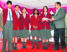 Winners of the Children�s Science Congress receive prizes from MLA Rao Yadvender Singh in Rewari.