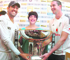 MS Dhoni and Kevin Pietersen jointly unveil the RBS Cup as Country Executive of ABN ABRO India, Meera H.Sanyal looks on, at MAC stadium in Chennai on Wednesday.