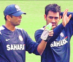 Rahul Dravid (L) interacts with Mahendra Singh Dhoni during a training session in Chennai.