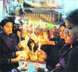Students of Jagat Jyoti School hold a candle light rally on the eve of the anniversary of the terrorist attack on Parliament House in Amritsar 