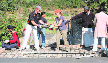 School students from abroad along with those from Doon School construct a house at Fatehgram village, near Herbertpur, Dehradun.