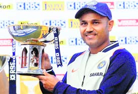 Virender Sehwag poses with �Man of the Match� trophy