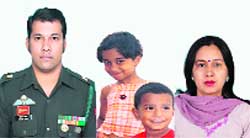 Major Sunder Bisht with his wife and children