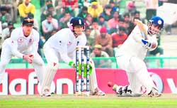 Gautam Gambhir dispatches one to the square leg fence during the second day of the second Test at Mohali 