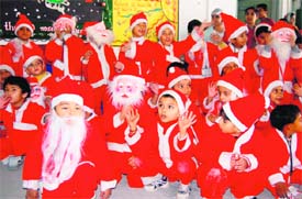 Students of Delhi Public School dressed as Santa Claus at Christmas-eve celebrations in Dehradun on Wednesday