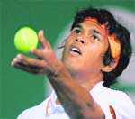 India�s Somdev Devvarman plays a return against US� Kevin Kim during their first round match