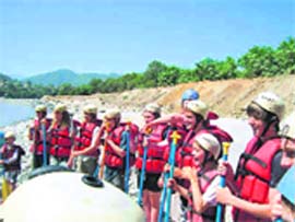 Students participate in river rafting on the Ganga at Srinagar Garhwal during their visit