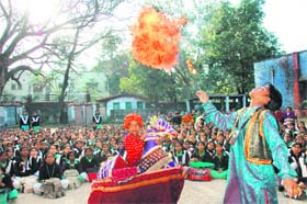 As part of a traffic awareness drive, child artistes perform at a school in Dehradun