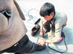A young polish boy with a customer in Dehradun.