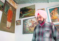Painter JS Jogi with his works of art in Dehradun. 