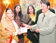 President Pratibha Patil releases an album of patriotic songs, written and sung by IGP Sheel Madhur, at PTC, Bhondsi, in Gurgaon.