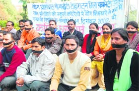 Unemployed yoga teachers stage a protest in Dehradun on Tuesday