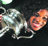 Serena Williams poses with the trophy after beating Dinara Safina.