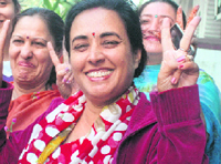 Mother of Junior Australian Open champion Yuki Bhambri, with relatives, celebrates his win at her residence in New Delhi on Saturday.