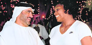 A handout picture made available by the Dubai Tennis Championships press office shows Serena Williams speaking with an unidentified official on Tuesday.