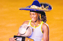 US� Venus Williams holds her trophy and a Mexican mariachi hat, after beating Flavia Pennetta in the Acapulco WTA Open final on Saturday.