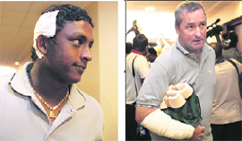 Ajantha Mendis, a member of the Sri Lankan cricket team and Paul Farbrace, the British coach of the Sri Lankan cricket team, who were injured during the attack against his team in Pakistan, arrive at Colombo airport in Sri Lanka