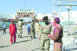 BSF jawans celebrate Holi with their Pakistani counterparts at the Attari-Wagah joint check post in Amritsar on Wednesday