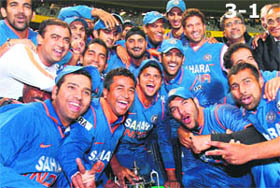 Indian team players pose with the trophy after the final one-day international between New Zealand and India in Auckland, on Saturday. India lost the final match by eight wickets but won the series 3-1, with one match abandoned.